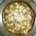Frittata met erwtenscheuten en feta