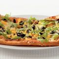 Pizza verdure met rucola