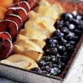 Open vruchtentaart met vier soorten fruit