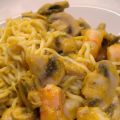 Slimpasta met champignons, scampi en pompoensaus