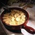 Ovenschotel van aardappelen, ui en spek