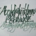 Geborduurd kalligrafie alfabet